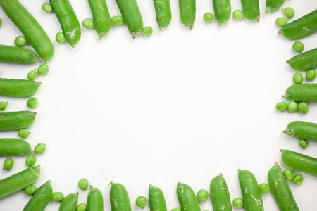 Frame of green peas on white backgroundの写真素材
