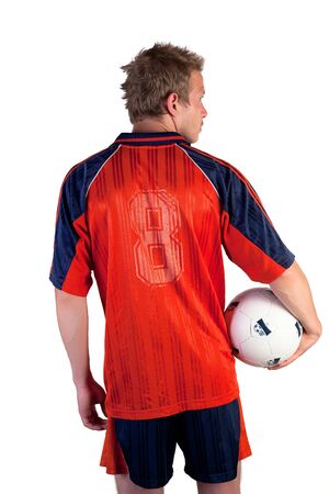 Football player posing with ball in hands on a white backgroundの写真素材