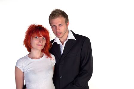 Boy and girl posing on a white backgroundの写真素材