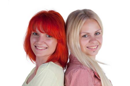 Two ladies posing on a white backgroundの写真素材