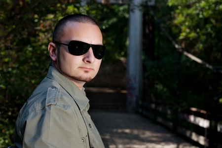 Cute man posing in forestの写真素材