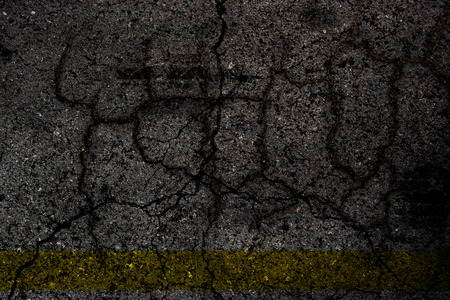 Cracked cement surface vignette background.の写真素材