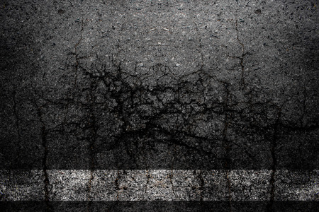 Background cracks asphalt textured.の写真素材
