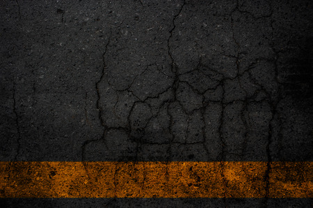Black crack asphalt texture backgroundの写真素材