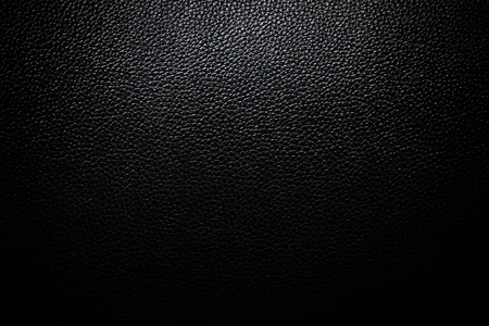 Black leather texture closeup background.の写真素材