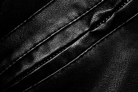 Black leather shirts texture closeup.の写真素材