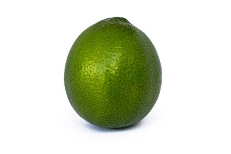 Lime with leaf on a white background.の写真素材