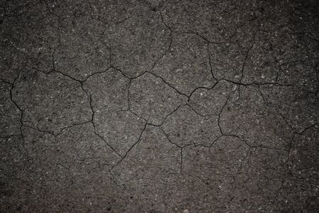 Black crack asphalt road surface background.の写真素材