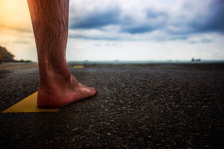 Foot man standing on the asphalt.の写真素材