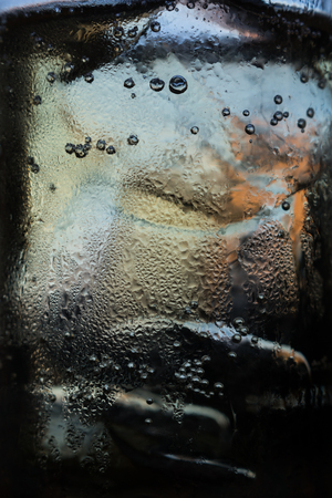 Bubbles in a glass of alcohol.の写真素材