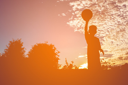 Children play football concept silhouette.の写真素材