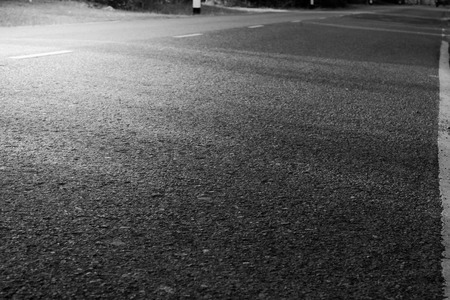 Asphalt road on light background.の写真素材