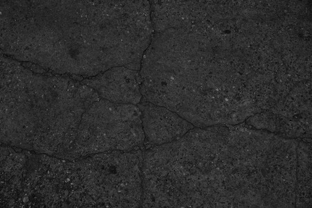 Crack black asphalt road surface background.の写真素材