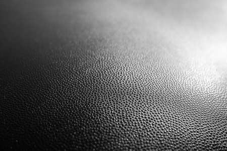 Black leather texture closeup background.の写真素材