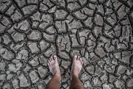 Crack soil drought area on stand foot.の写真素材