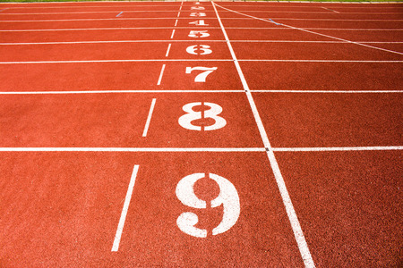 Red running track number background.の写真素材