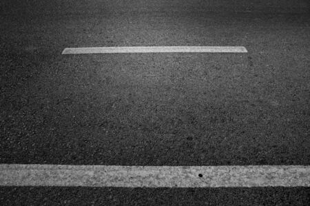 Black asphalt road textured background.