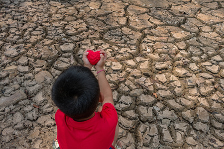 Child on dry ground, Drought concept.の写真素材