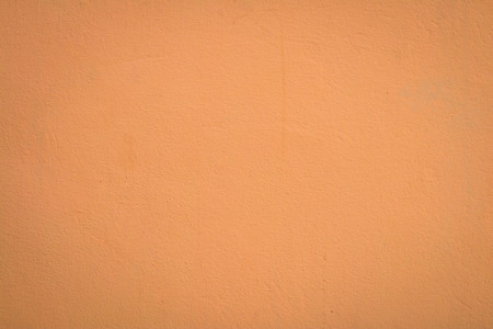 Orange color concrete wall background.