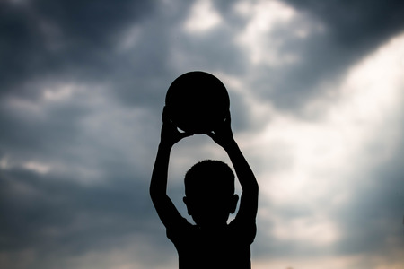 Children play football silhouette, Concept play football.の写真素材