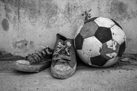 Old football and shoes vintage close up.の写真素材