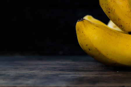 Banana on wood close up.の写真素材
