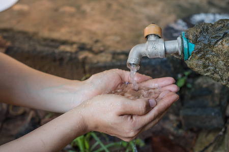 Women use hand the water frame to drink ,Water shortage concept.の写真素材