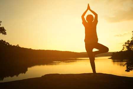 Silhouette young women yoga on nature, Concept yoga.の写真素材