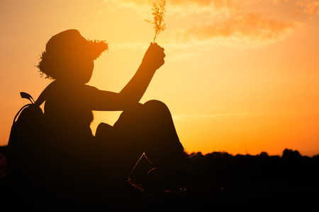 Silhouette girl backpack in nature, Concept silhouette mbackpack.の写真素材