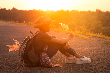 Silhouette girl backpack in nature, Concept silhouette mbackpack.の写真素材