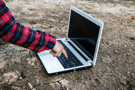 Young women use technology to solve drought, Concept technology has helped.の写真素材