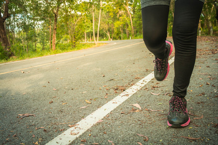Young fitness women running at road.の写真素材
