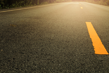 Line yellow on asphalt black texture.