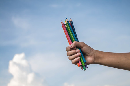 Handle color pencil on the sky background.の写真素材