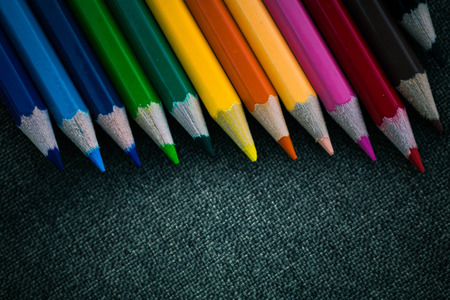 Crayon on black fabric background.の写真素材