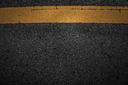 Line yellow old on asphalt black texture.の写真素材