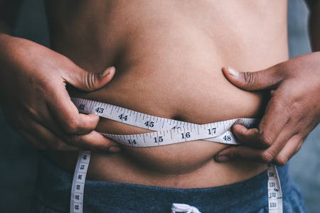 The boys with the waist line want to lose weight.