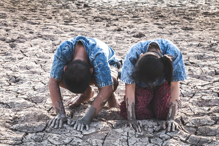 The cracked dry ground due to drought, food shortages and water,  Concept drought and crisis environment.の写真素材