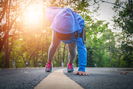 Women runner feet on road in workout wellness concept.の写真素材