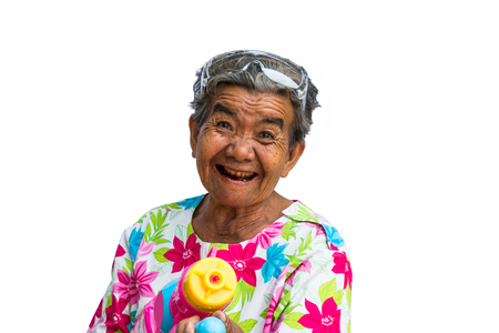 Grandmother playing water in Songkran festival isolated on white background.の写真素材