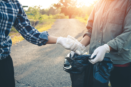 Women volunteer help garbage collection charity environment.の写真素材