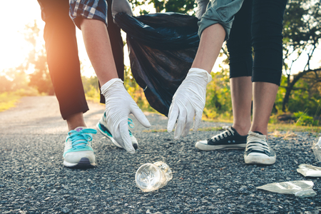 Women volunteer help garbage collection charity environment.の写真素材