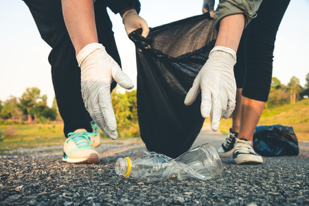 Women volunteer help garbage collection charity environment.の写真素材