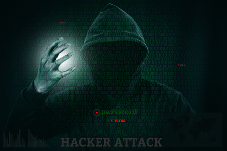 Dangerous hacker stealing data over a screen with binary code.の写真素材