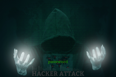 Dangerous hacker stealing data over a screen with binary code.の写真素材