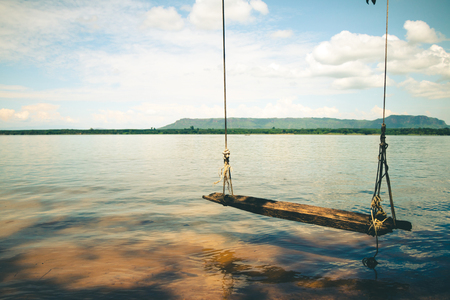 Beachfront swings in beautiful nature.の写真素材