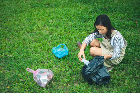 Women volunteer help garbage collection charity environment, concept cleaning.の写真素材