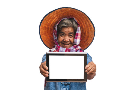 His grandmother used taplet and modern technology to work in agriculture isolated  white background.の写真素材