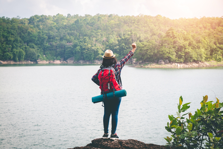 Female tourists in beautiful nature in tranquil scene, concept tourists backpack.の写真素材
