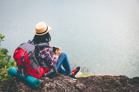 Female tourists in beautiful nature in tranquil scene, concept tourists backpack.の写真素材